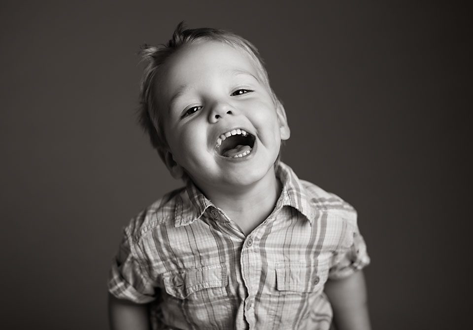 young boy laughing