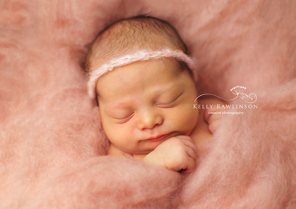 Bradford Newborn Photos.  Baby girl in pink wool.