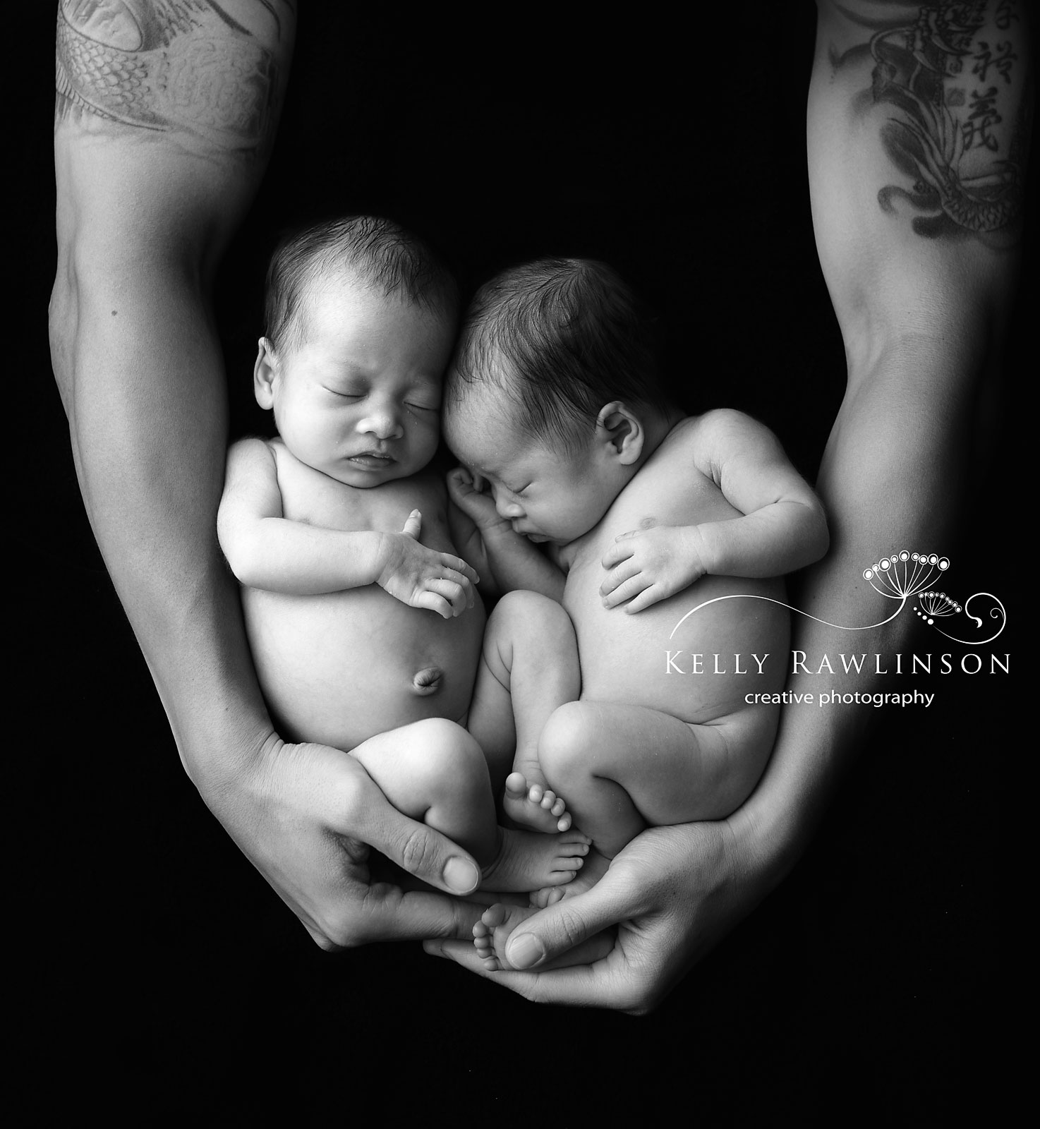 Aurora Ontario twin girls wrapped in daddy's arm, black and white photo