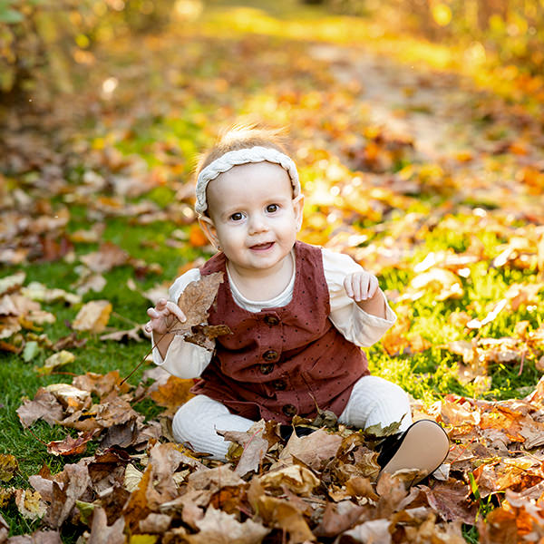 Toddler smiling at camera, in Newmarket Fall Family photo