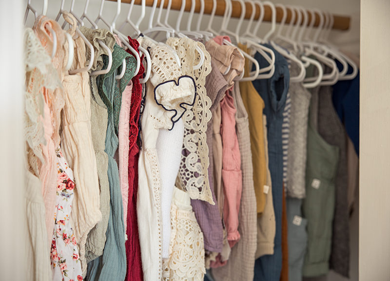 Closet full of clothing available for birthday photo sessions