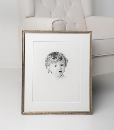 Expertly Framed Heirloom Portrait leaning against chair