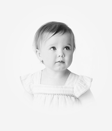 Black and white vintage look portrait of 1 year old girl